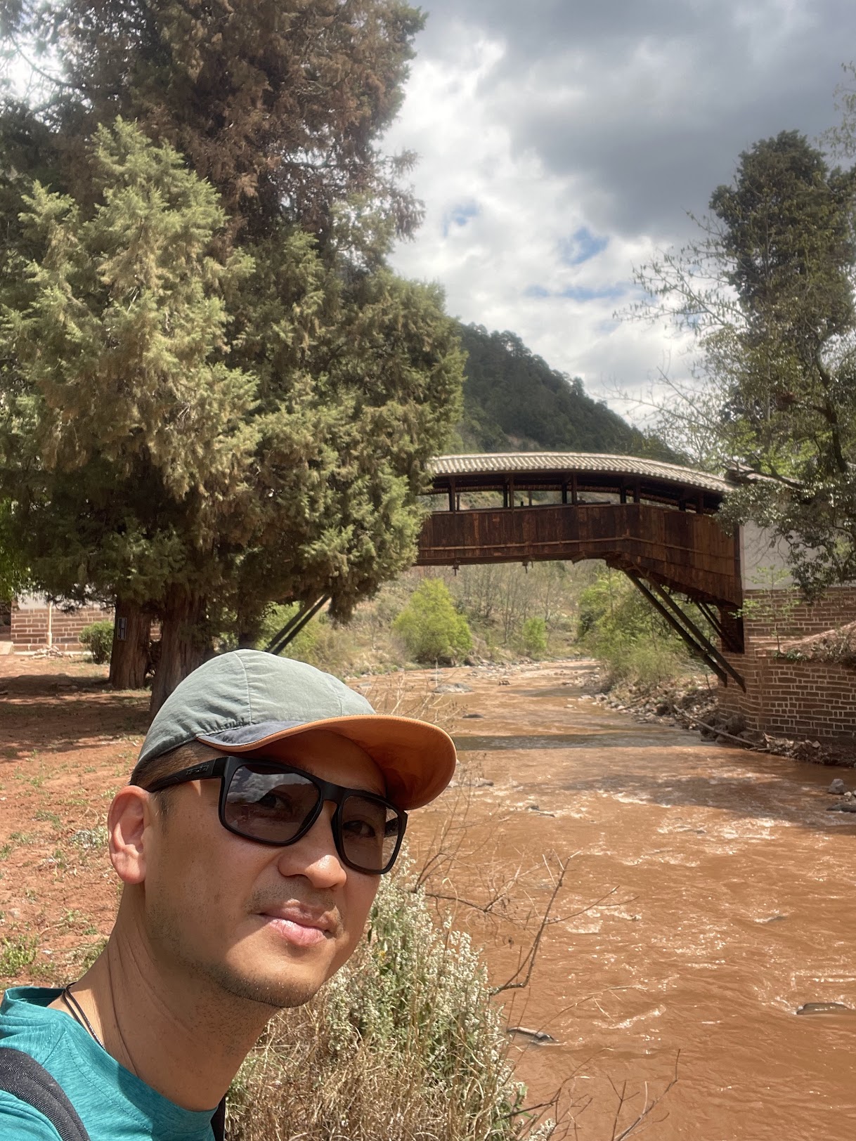 The River Bridge — a covered wooden crossing over the red current